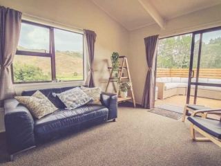 Cottage Lounge looking out over the hills